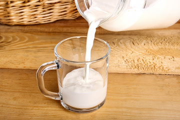 rustic fresh milk is poured from a jug