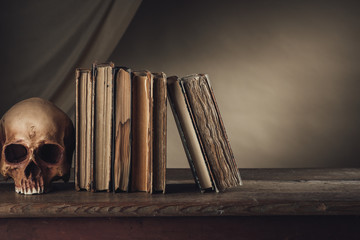 Ancient books with skull © stokkete
