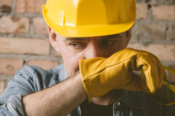 portrait of construction worker with yellow hat