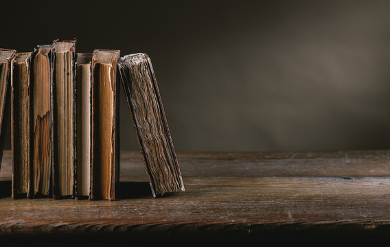 Ancient Books On An Old Table