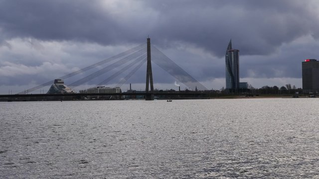 Riga, Latvia. The view to cable stayed bridge and Sun Stone from Kipsala island. Daugava river.
