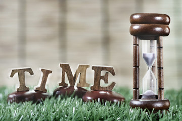 Sandglass and wooden alphabet, Time management concept and in time idea