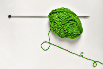 ball of yarn and knitting pin