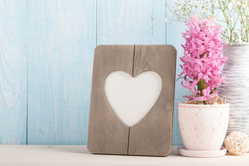 Heart shaped blank frame and spring flowers