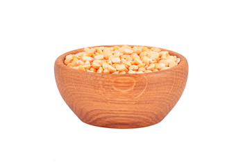 Dried yellow pea in wooden bowl