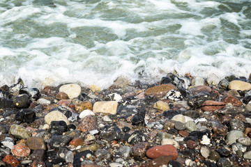 stony beach and ocean water