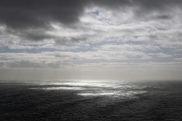 Obraz premium The storm clouds covered the sun over the sea. Cabo da Roca.