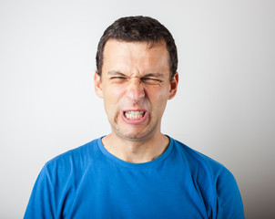 Fototapeta premium Young man expressing emotions