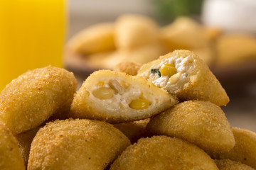 Rissole - Corn and cheese rissole served with chili sauce on woo