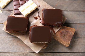 Delicious chocolate brownies on wooden background