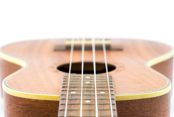 Fototapeta premium Part of brown ukulele isolate white background 