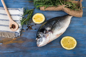  Raw dorado fish with  rosemary and lemon, cooking process