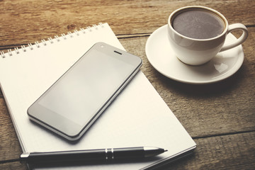 coffee with notebook and phone