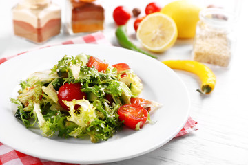 Tasty salmon salad on light wooden background