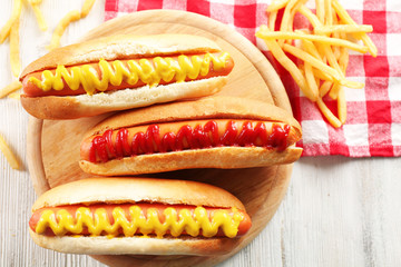 Hot dogs with fried potatoes closeup