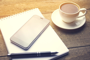 coffee with notebook and phone