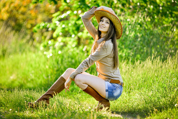 brunette young girl walking in the spring park