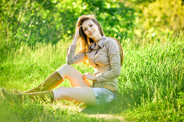 brunette young girl walking in the spring park