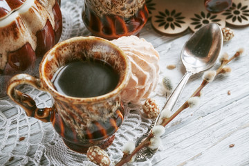 cups of coffee with a pussy willow, candies and a zephyr