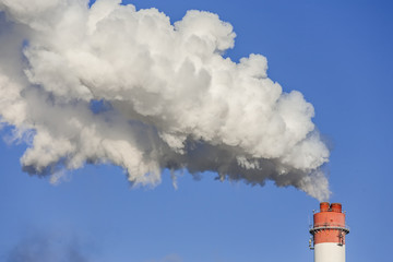 Big chimneys with dramatic clouds of smoke.