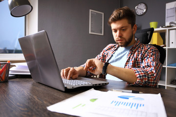 Business and time management concept. Stressed business man looking at wrist watch. Human emotion