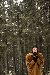 man in the winter forest
