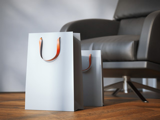 Two shopping bags near modern black armchair. 3d rendering