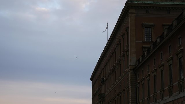 Riksdag Parliament Building  and the swedish flag in Stockholm