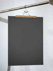Trouser hanger with black paper sheet. 3d rendering