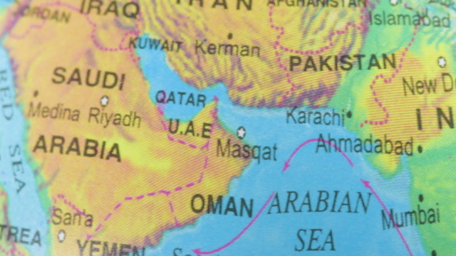 Terrestrial globe smoothly rotates and stops at the map of Saudi Arabia