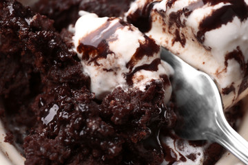 Chocolate lava cake with ice-cream and fork, close-up