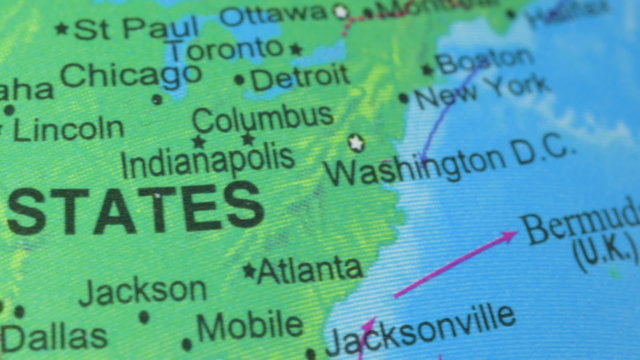 Terrestrial globe smoothly rotates and stops at the map of the United States of America