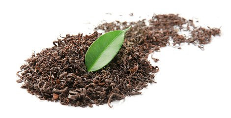 Pile of dry tea with green leaf, isolated on white