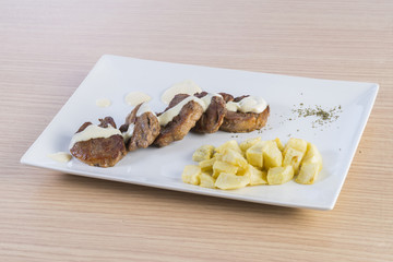 Fillet of beef with cheese sauce.