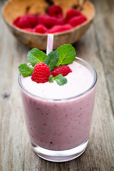 Raspberry milk shake with mint decor.