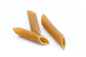 Rye flour macaroni pasta close up isolated on white.