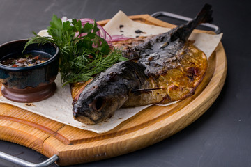 fried fish with fresh herbs and lemon