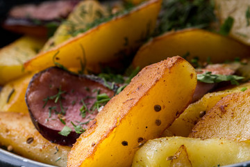 Fried potatoes with fried sauseges, rustic breakfast