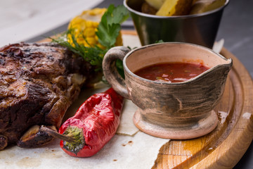 Assorted delicious grilled meat with vegetable over wooden plate