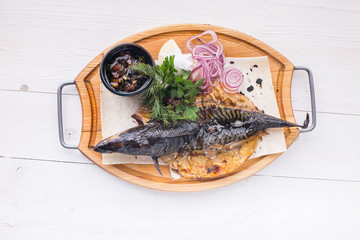 fried fish with fresh herbs and lemon