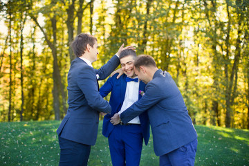 Friends laughing at the wedding of a friend