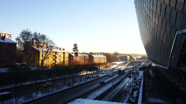 Establishing shot of Stockholm, car traffic and global arena
