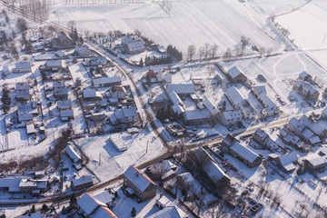 Obraz premium aerial view over the harvest fields in winter