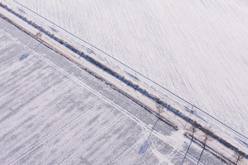 aerial view  over the harvest fields in winter