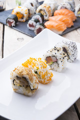 Salmon and caviar rolls served on a plate