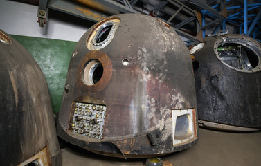 The spacecraft for the descent of man from space, after landing. On the dark warehouse before disposal. Focus on the lander © Всеволод Чуванов
