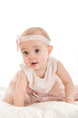 Baby girl with nice little dress against white background