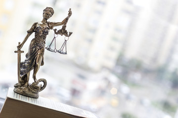 Justice statue with sword and scale. Law concept