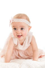 Baby girl crawling against white background