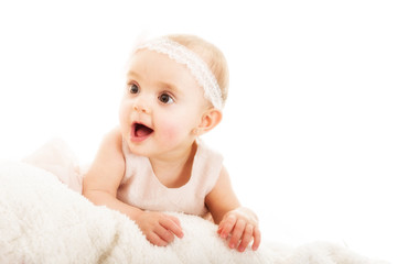 Baby girl being amazed against white background